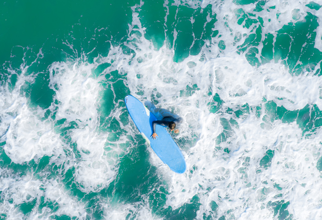 Surfers catching the perfect wave