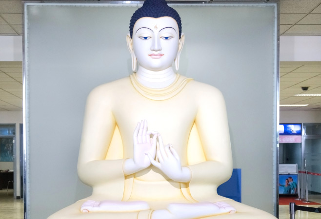 The Buddha statue is located in the transit area at Bandaranaike International Airport.